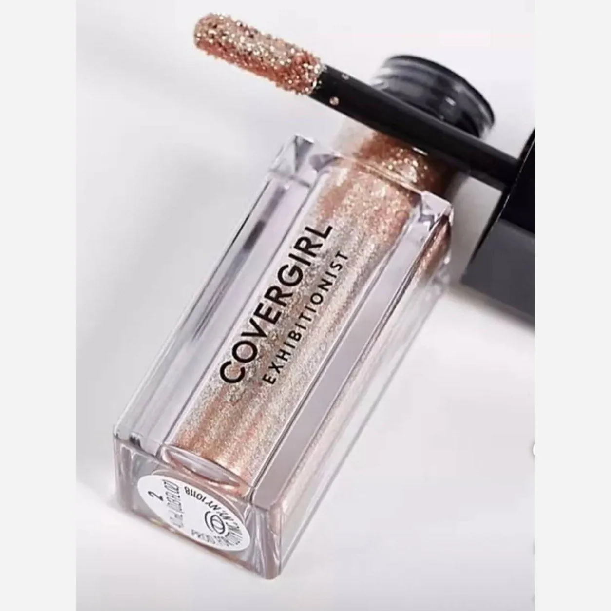 سایه مایع گلیتری برند آمریکایی کاورگرل رنگ رزگلد covergirl
